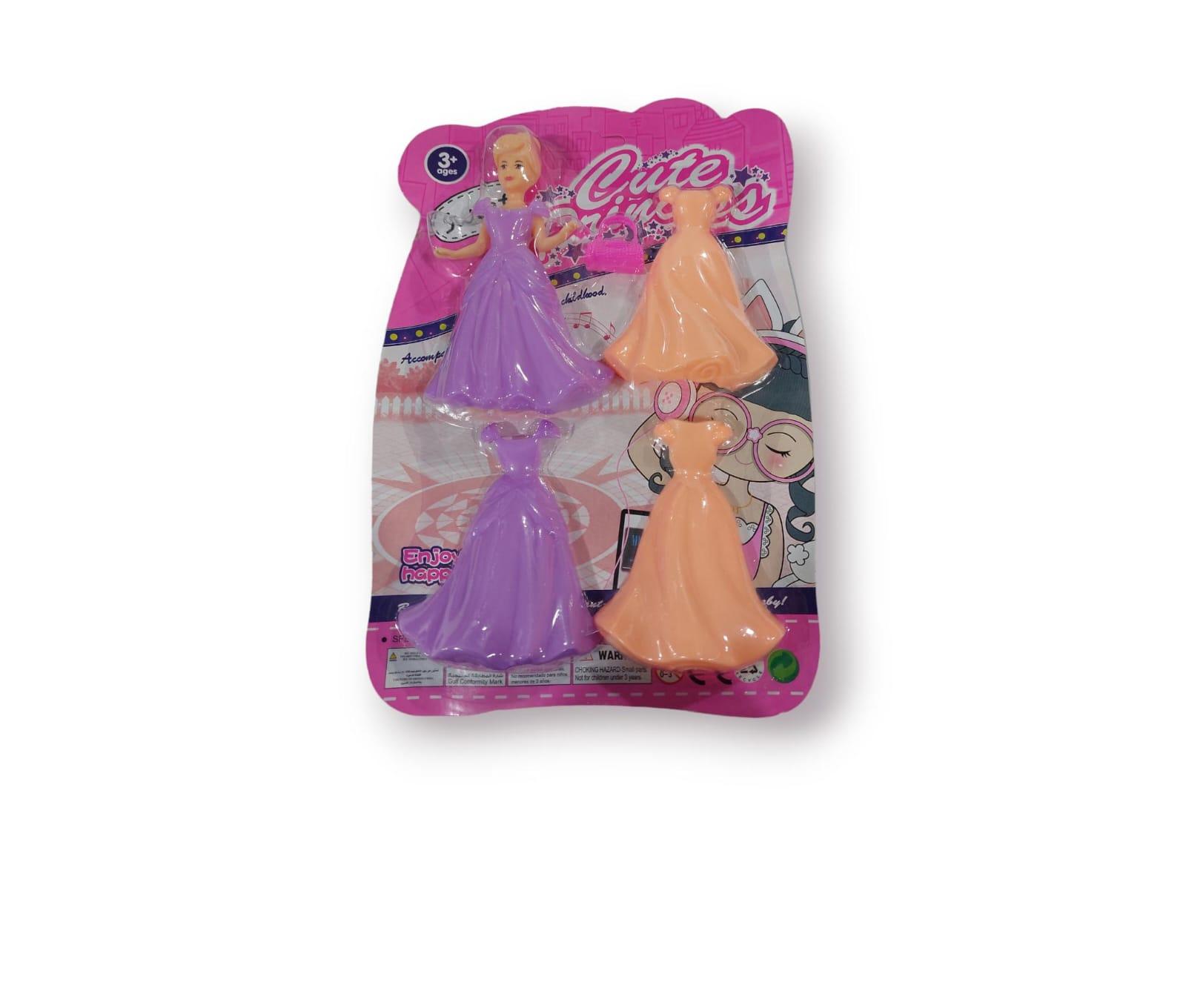 MUÑECA CON 2 VESTIDOS + CARTERA  8X13CM
